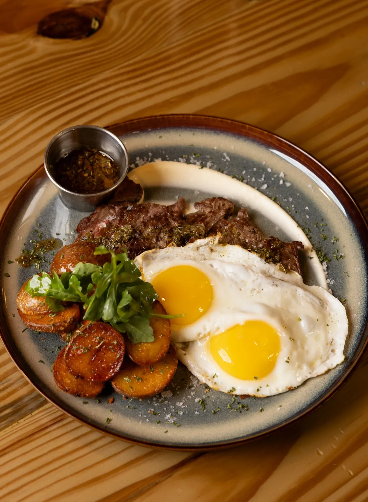 Churrasco a caballo, grilled skirt steak topped with eggs, at Sensaciones