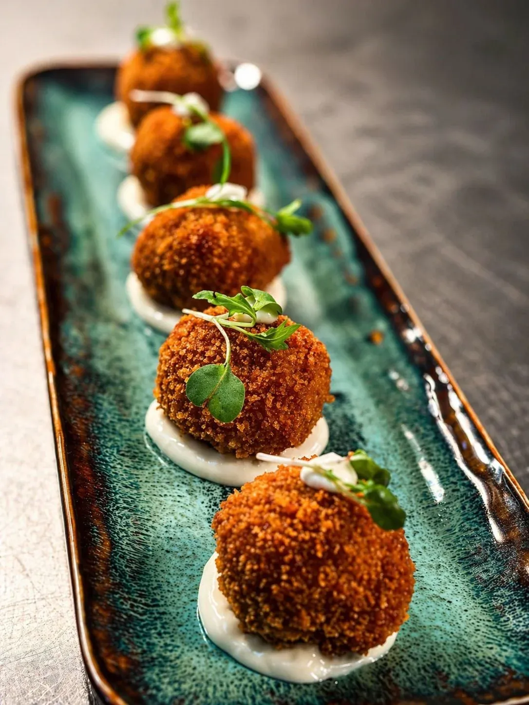 Artisanal Cuban ham croquettes with house alioli at Sensaciones