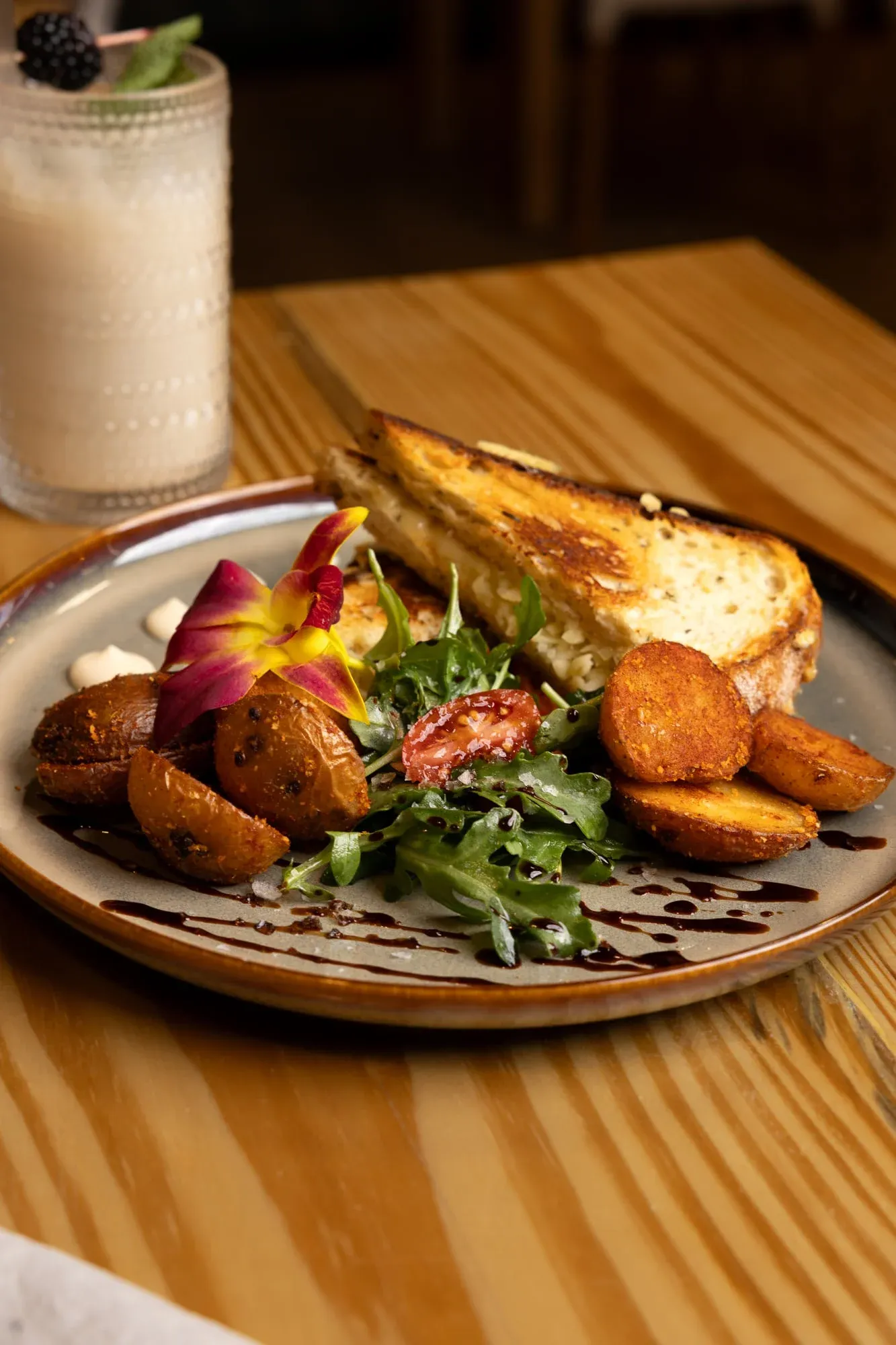 Grilled cheese sourdough sandwich with arugula at Sensaciones